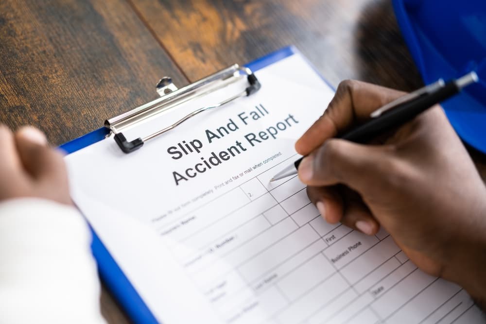 Man Filling Slip And Fall Accident Report Form